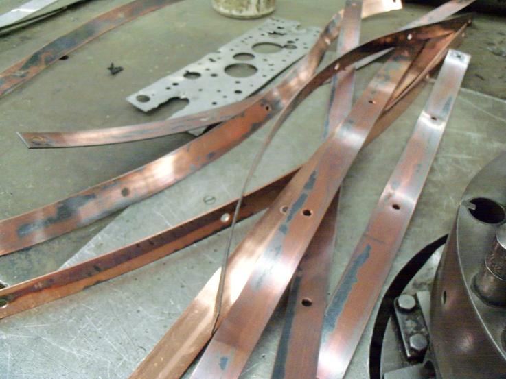 Copper luggage straps.